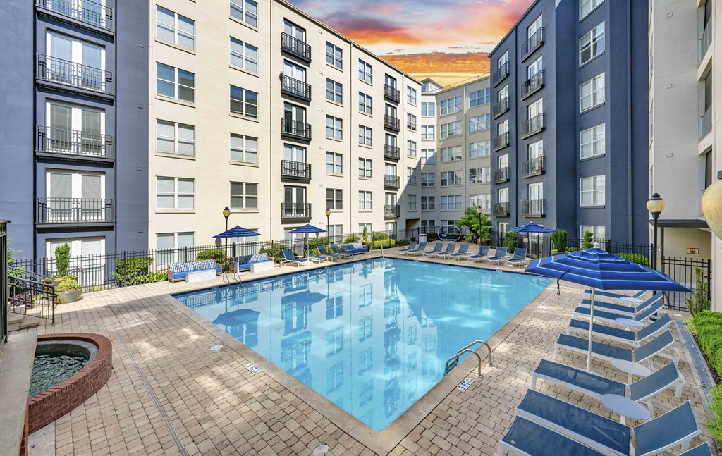 a swimming pool at an apartment building with an outdoor pool